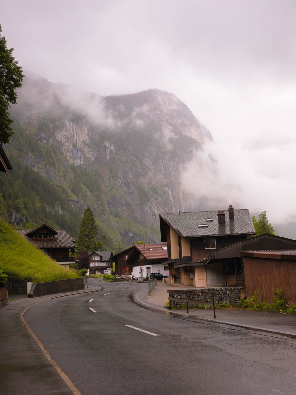 Misty alpine valley and wooden shelter